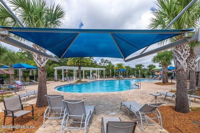 view of pool featuring a pergola and a patio