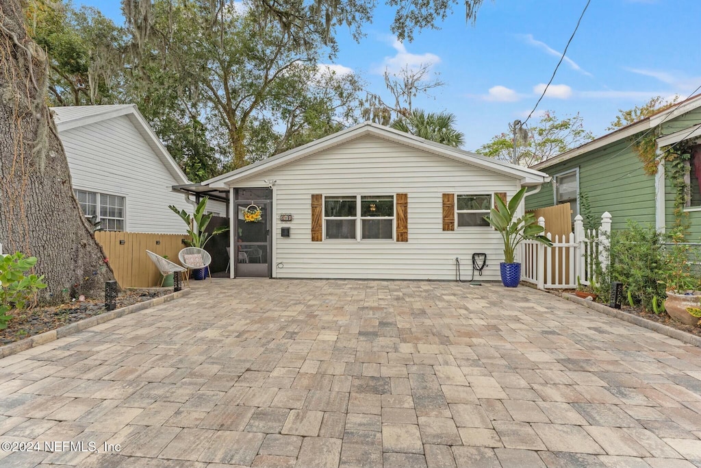 rear view of property featuring a patio area