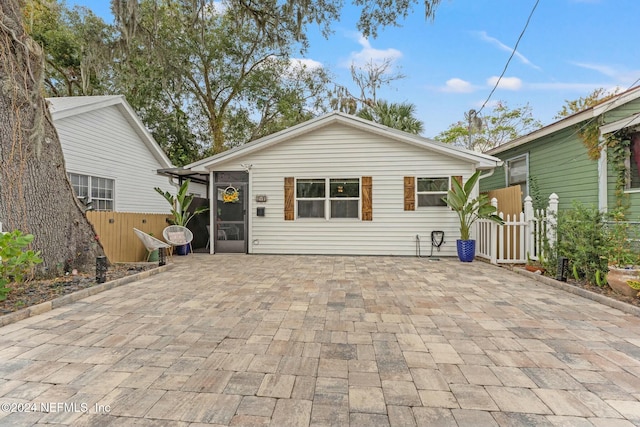 rear view of property featuring a patio area