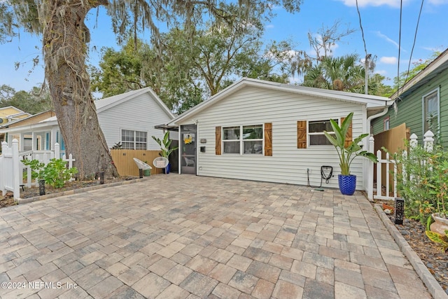 back of property with a patio