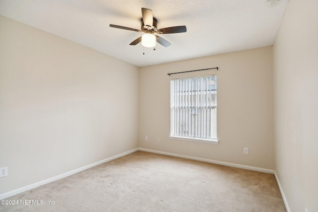 unfurnished room with carpet flooring, a textured ceiling, and ceiling fan