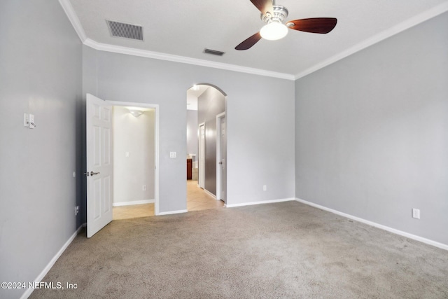 unfurnished bedroom with ceiling fan, light colored carpet, and ornamental molding