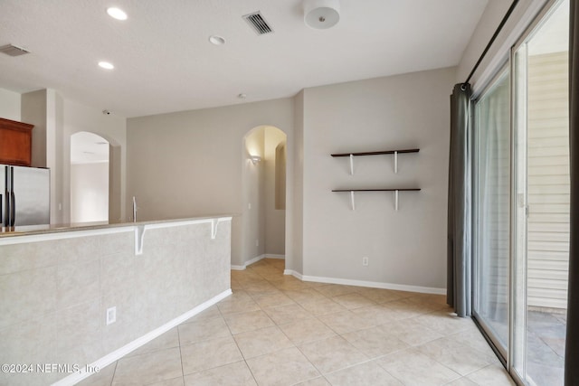 interior space featuring light tile patterned floors