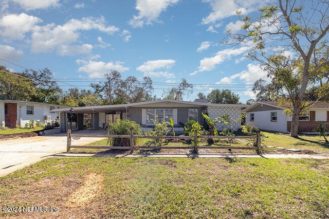 ranch-style house with a front lawn and a carport