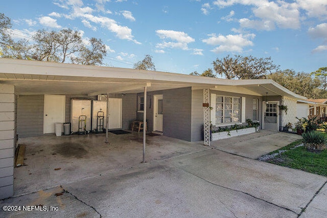 view of front of property with a carport