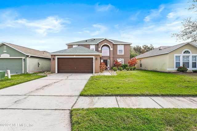 view of front of home featuring a garage and a front lawn