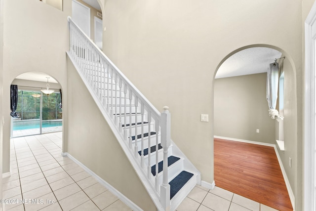 stairway with hardwood / wood-style flooring