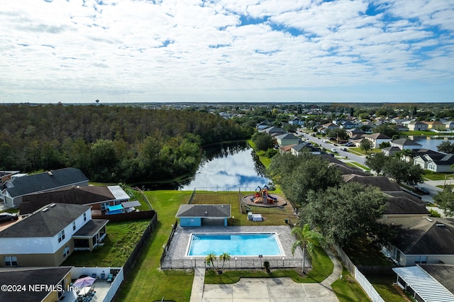 birds eye view of property with a water view