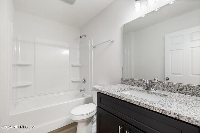 full bathroom with shower / bathing tub combination, vanity, hardwood / wood-style flooring, and toilet