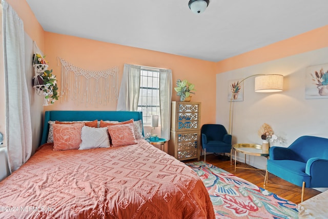 bedroom with wood-type flooring