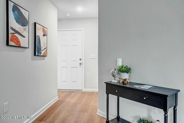 hallway featuring light hardwood / wood-style flooring