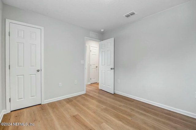 unfurnished bedroom featuring light hardwood / wood-style flooring