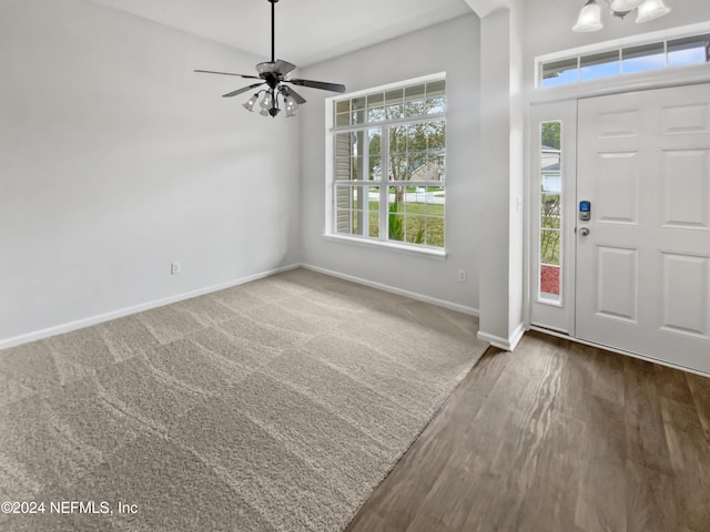 foyer with hardwood / wood-style floors and ceiling fan