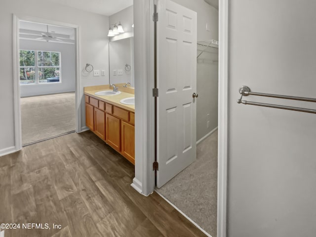 bathroom featuring vanity, hardwood / wood-style flooring, and ceiling fan