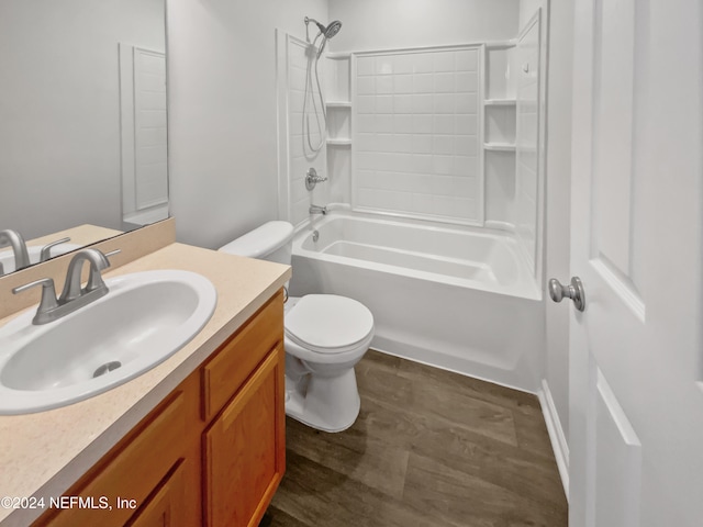 full bathroom featuring vanity, hardwood / wood-style flooring, toilet, and shower / washtub combination