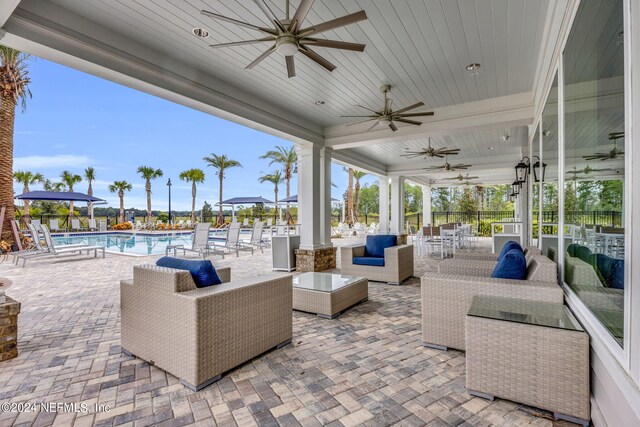 151 Fairlake Cir, Saint Augustine, FL 32092 - view of patio / terrace with a ceiling fan, a community pool, and an outdoor living space