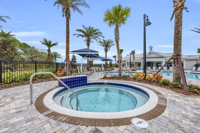 151 Fairlake Cir, Saint Augustine, FL 32092 - community pool featuring a community hot tub and a patio area