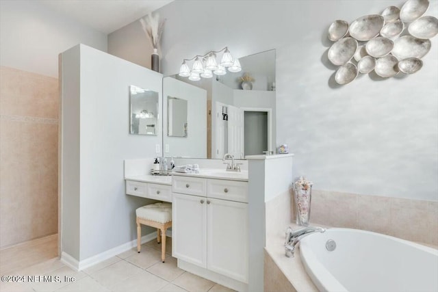 bathroom with vanity, tiled bath, and tile patterned floors