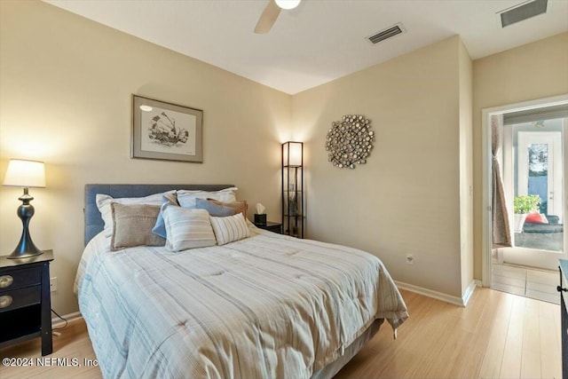 bedroom with ceiling fan and light hardwood / wood-style flooring