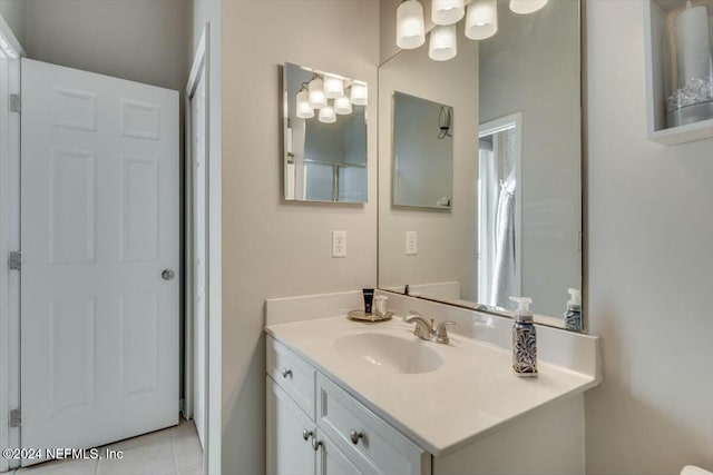 bathroom with tile patterned flooring and vanity