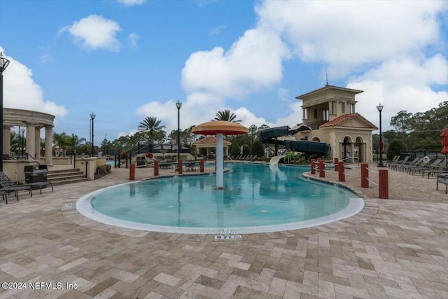 view of swimming pool featuring a water slide