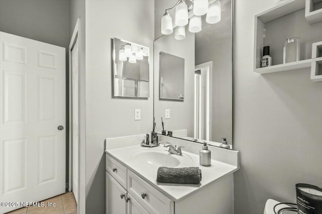 bathroom with tile patterned floors and vanity