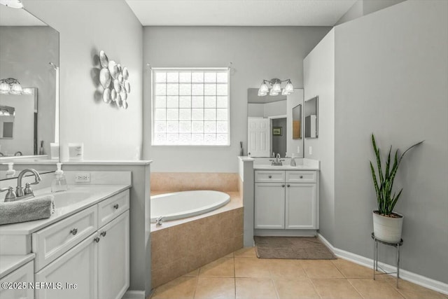 full bathroom featuring tile patterned flooring, a sink, two vanities, and a bath