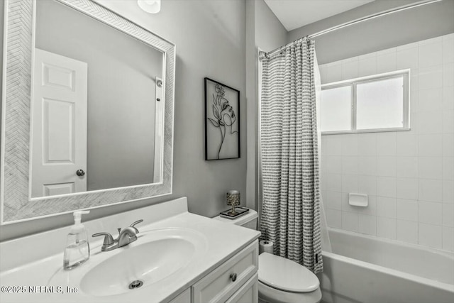 full bath with vanity, toilet, and shower / tub combo