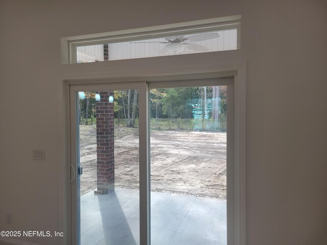 doorway to outside featuring ceiling fan
