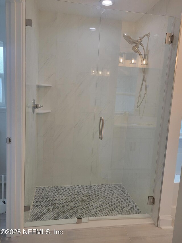 bathroom featuring a stall shower