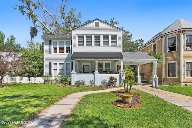 view of front of house featuring covered porch and a front yard