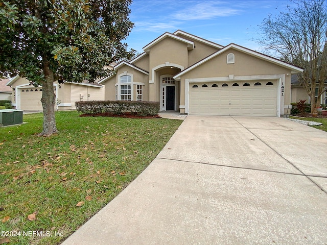 single story home featuring central AC, a front lawn, and a garage