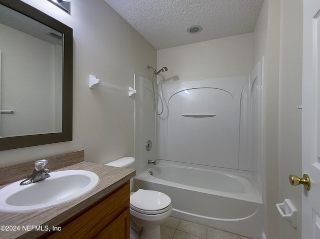 full bathroom with shower / bath combination, tile patterned floors, vanity, a textured ceiling, and toilet