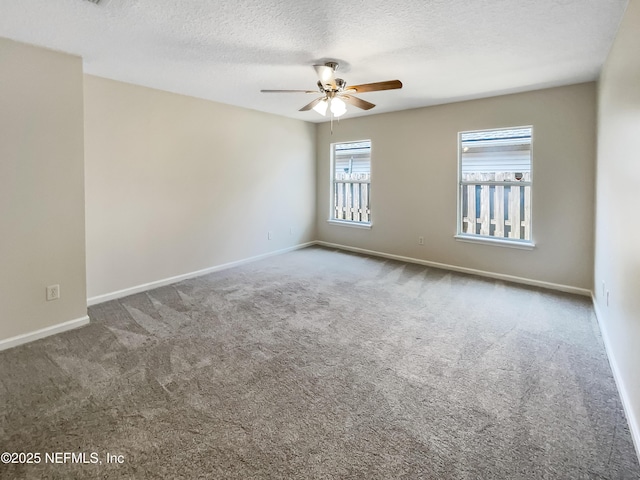 1421 Woodland View Dr, Fleming Island, FL 32003 - carpeted spare room featuring baseboards, ceiling fan, and a textured ceiling