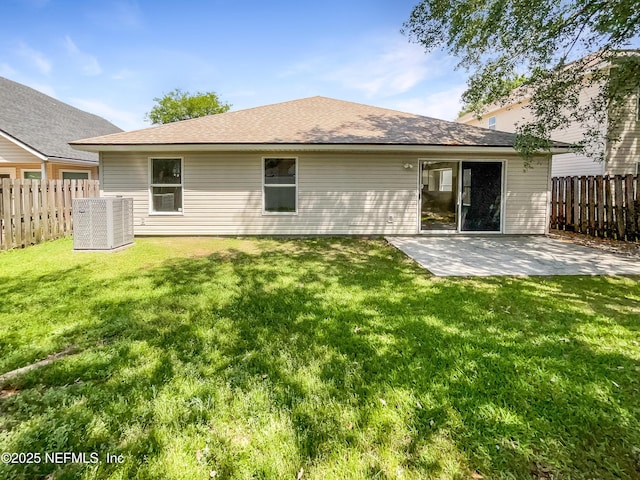 1421 Woodland View Dr, Fleming Island, FL 32003 - rear view of property featuring a yard, central AC, fence, and a patio area