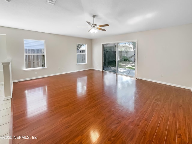 1421 Woodland View Dr, Fleming Island, FL 32003 - spare room featuring baseboards, a ceiling fan, wood finished floors, and visible vents