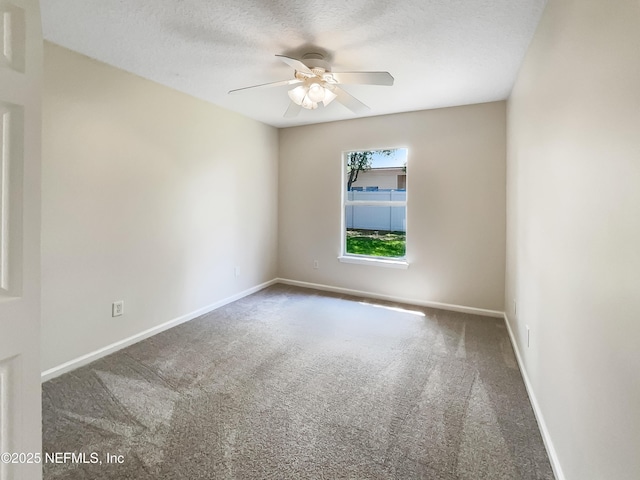 1421 Woodland View Dr, Fleming Island, FL 32003 - empty room with carpet flooring, a ceiling fan, baseboards, and a textured ceiling