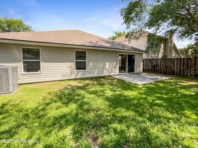 1421 Woodland View Dr, Fleming Island, FL 32003 - rear view of property featuring fence, a shingled roof, cooling unit, a patio, and a yard