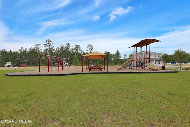 community jungle gym with a lawn