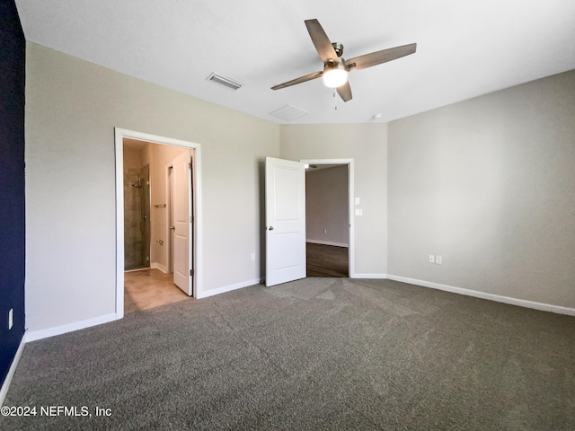 unfurnished bedroom with ensuite bathroom, ceiling fan, and carpet floors