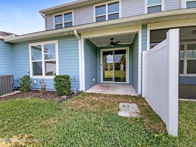 entrance to property featuring ceiling fan and central air condition unit