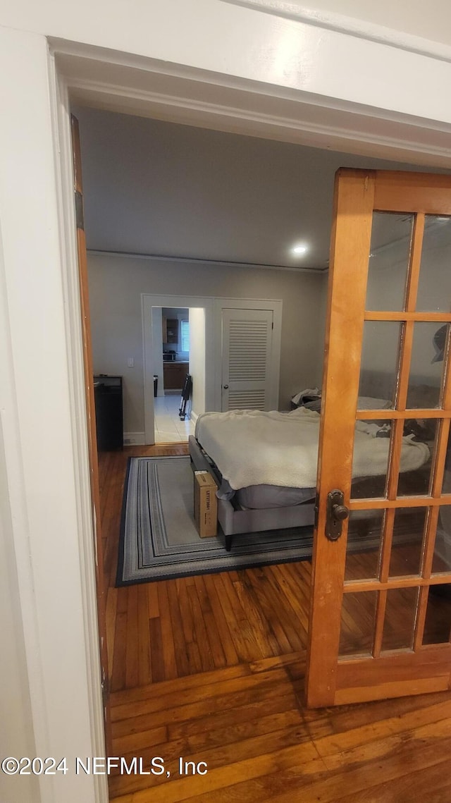 bedroom with wood-type flooring