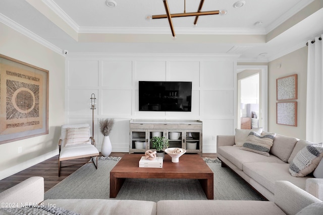 living room featuring hardwood / wood-style floors and ornamental molding