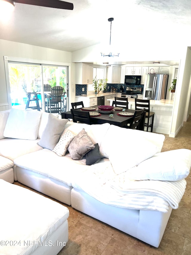 living room with an inviting chandelier