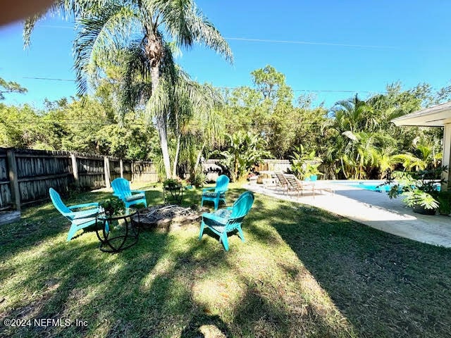 view of yard with a fenced in pool and a patio area