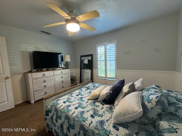 carpeted bedroom with ceiling fan