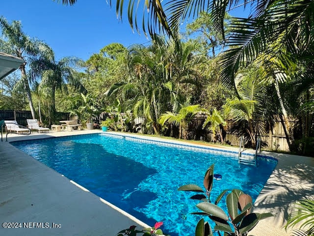 view of pool featuring a patio area