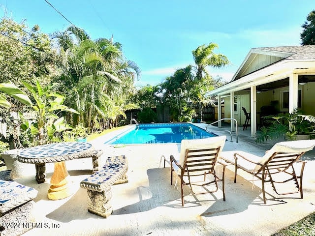 view of pool featuring a patio area