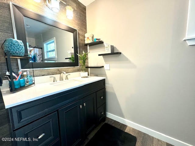 bathroom featuring vanity and hardwood / wood-style flooring