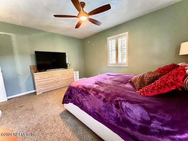 bedroom with carpet flooring and ceiling fan